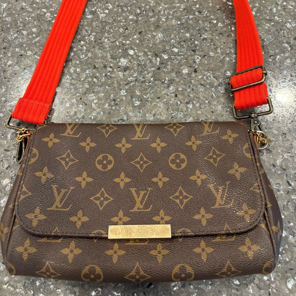 Excellent condition Authentic Louis Vuitton cross body or clutch.